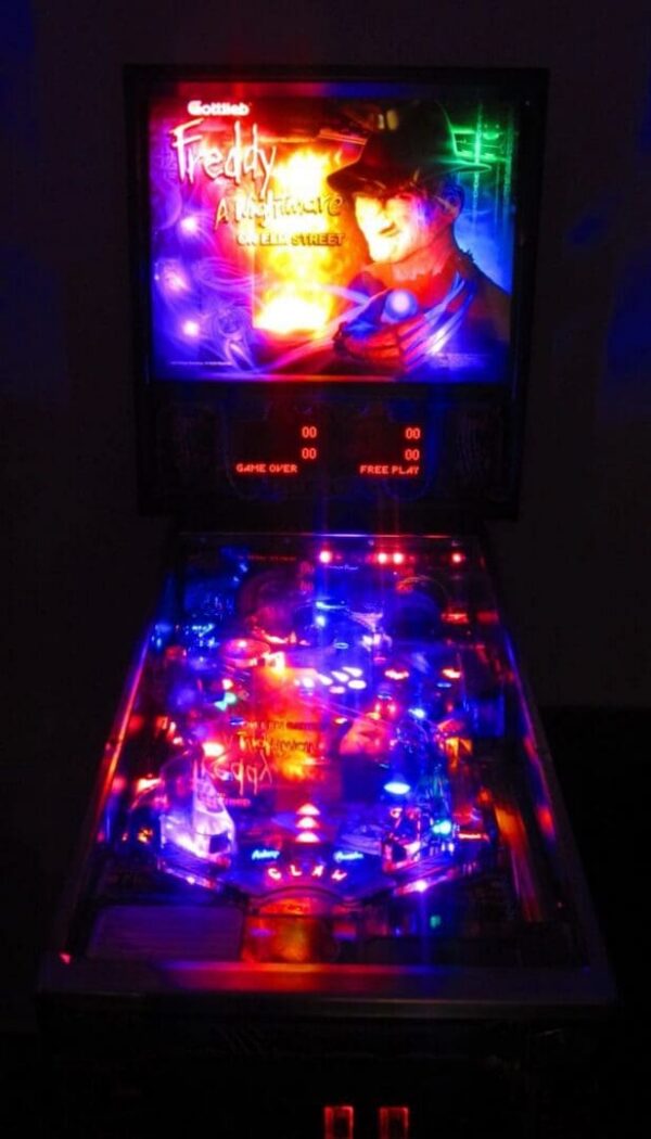 Neon-lit horror pinball machine