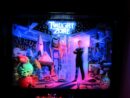 A man standing in front of neon lights.