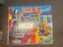 A pinball machine with dracula on it.
