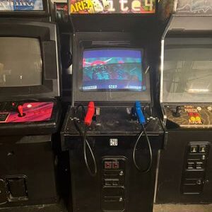 A video game system with two controllers and several different games.