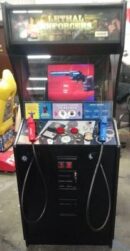 A video game machine with two controllers and a gun.