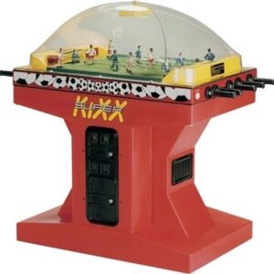 A red train station with a soccer field on the top.