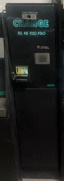 A black door with a sign on it.