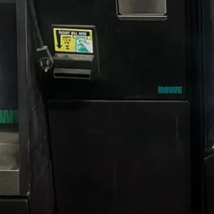 A black door with a sign on it.