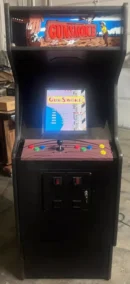 A small arcade machine with buttons and a screen.
