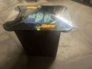 A table with a glass top and some type of video game.