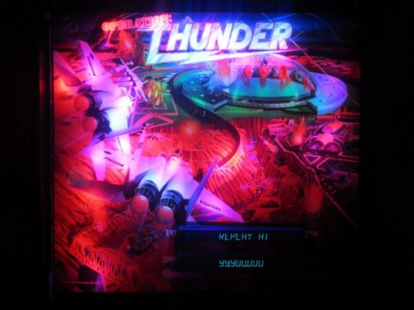 A neon sign that says thunder and has some kind of artwork on it.