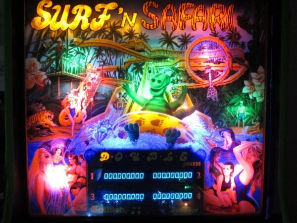A neon sign with various images of people and animals.