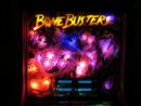 A neon sign that reads bone busters.