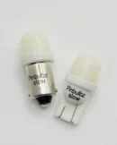 A couple of white lights sitting on top of a table.