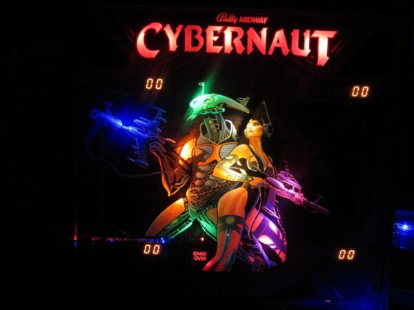A neon sign that says cybernaut with some people