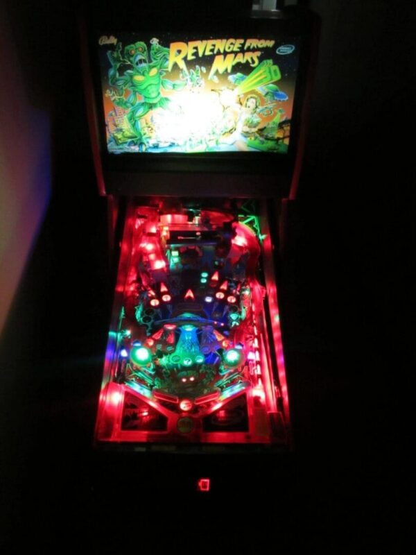 Neon-lit "Revenge from Mars" pinball machine