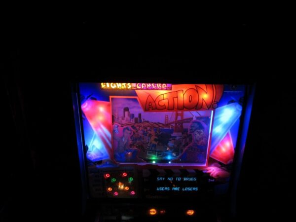 A lighted arcade game with the lights on.