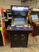 A black arcade machine with the game g. I. Joe : the movie on it