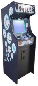 A video game machine with a cartoon face on it.