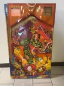 Colorful retro pinball board with T-rex