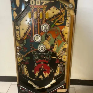 A pinball machine with many different buttons and a large number.