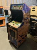A video game cabinet with the controls on it.