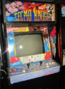 A video game machine with the words " tecmo knight ".
