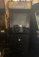 A video game system with steering wheel and controls.